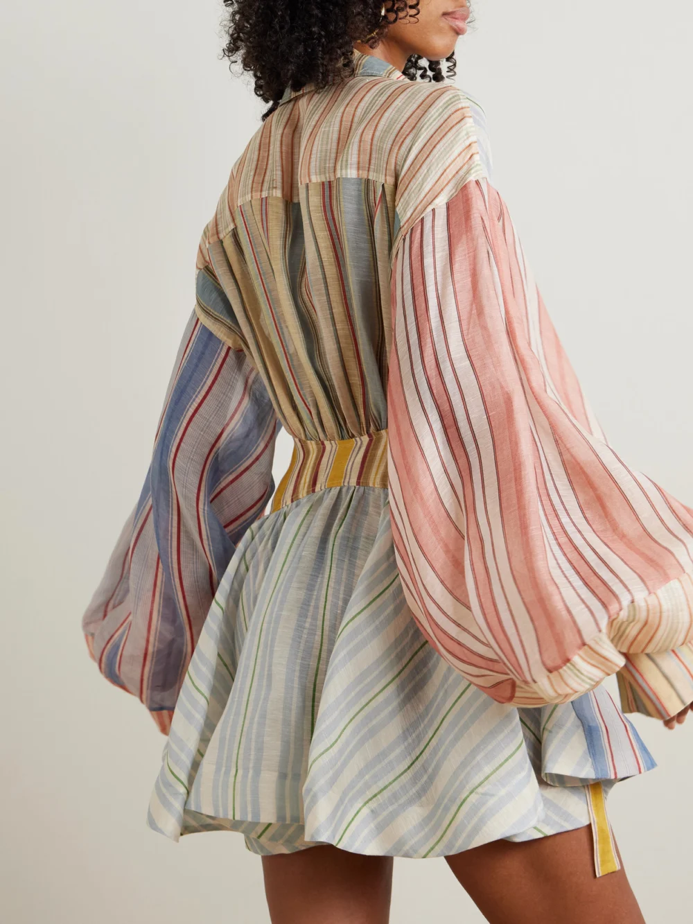 Back view of the Zimmermann Rebellion Patchwork Striped Linen and Silk-blend Voile Mini Wrap Dress