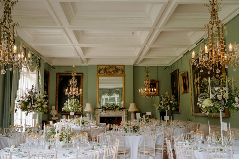 The Ballroom laid for a wedding breakfast with round tables, white flowers and candelabra, Birdsall House