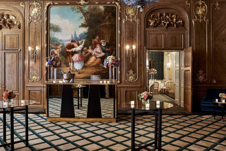 The French Salon with its carved panelling and a painted mural above a fireplace, Claridge's