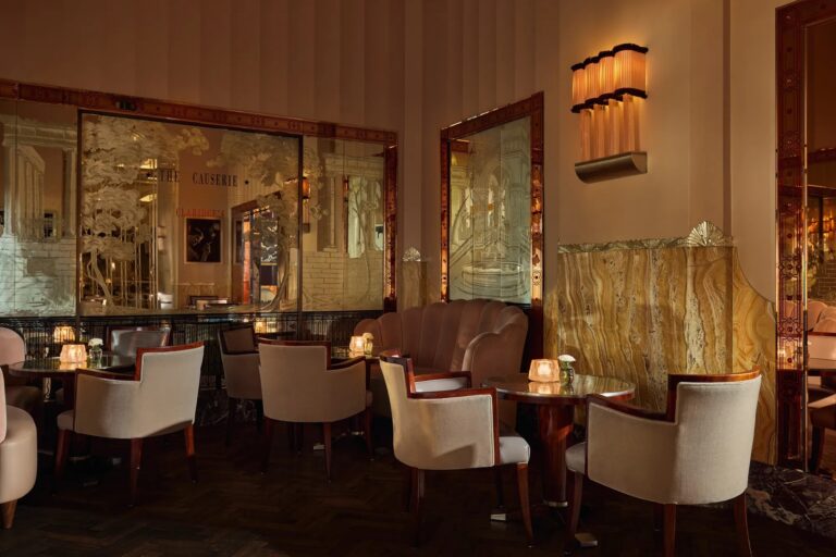 The Fumoir, a small bar with low armchairs, mirrored panels and warm lighting, Claridge's