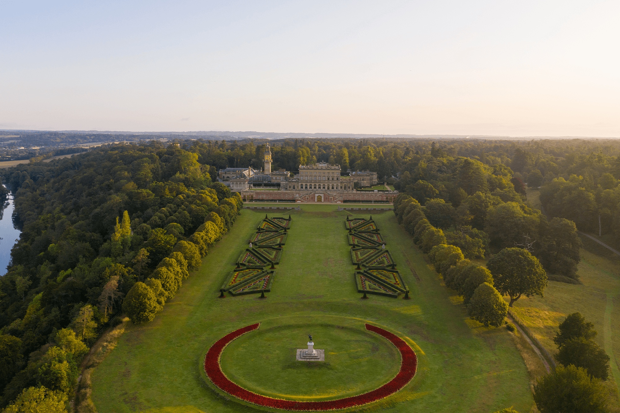 Aerial view over the Parterre and its round central lawn towards the south front of the house, Cliveden House