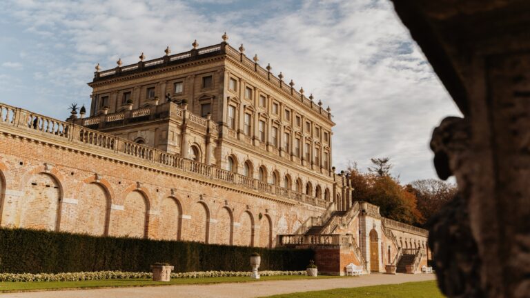 The south front of the house above the arcaded brick terrace wall and double stair, Cliveden House