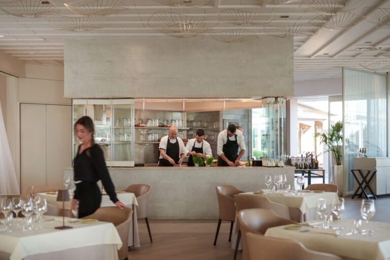 La Terrazza's dining room, with chefs at work in the open kitchen, Conrad Chia Laguna Sardinia