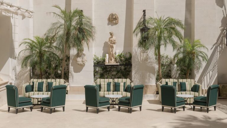 The Palm Court courtyard set with green armchairs under the palms, Hassler Roma