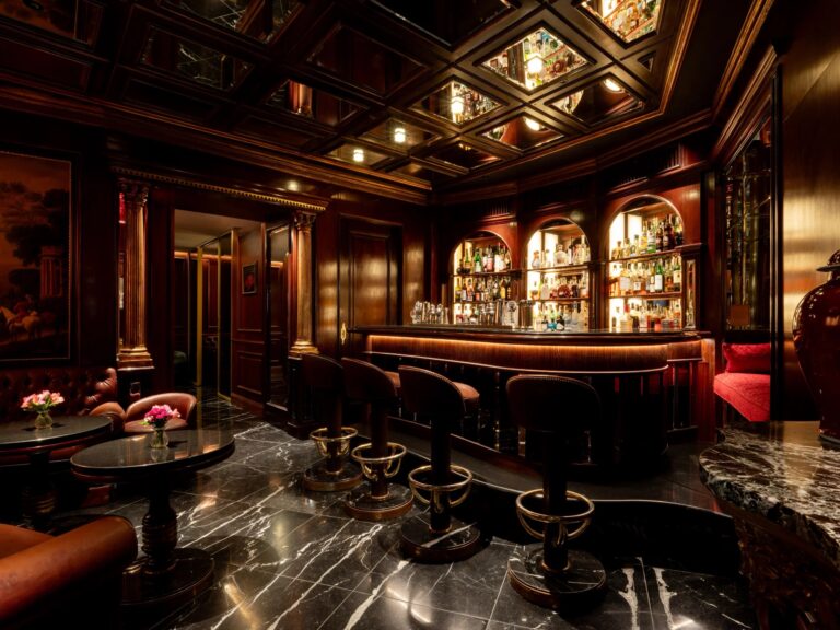 Carmen's Bar, with dark wood panelling, a painted mural and a marble floor, Hassler Roma