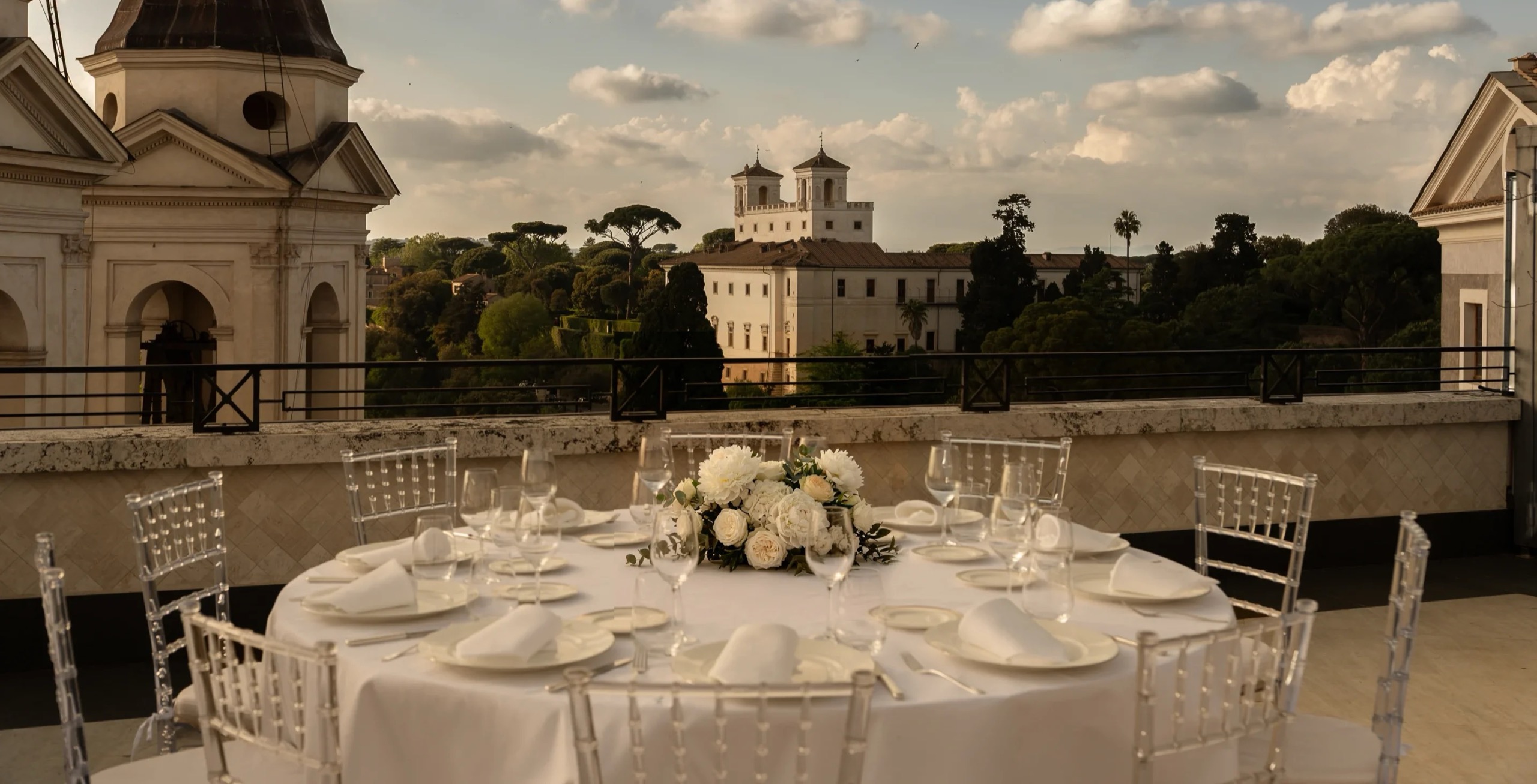 Tables set on the Villa Medici Penthouse terrace, looking towards the Villa Medici, Hassler Roma