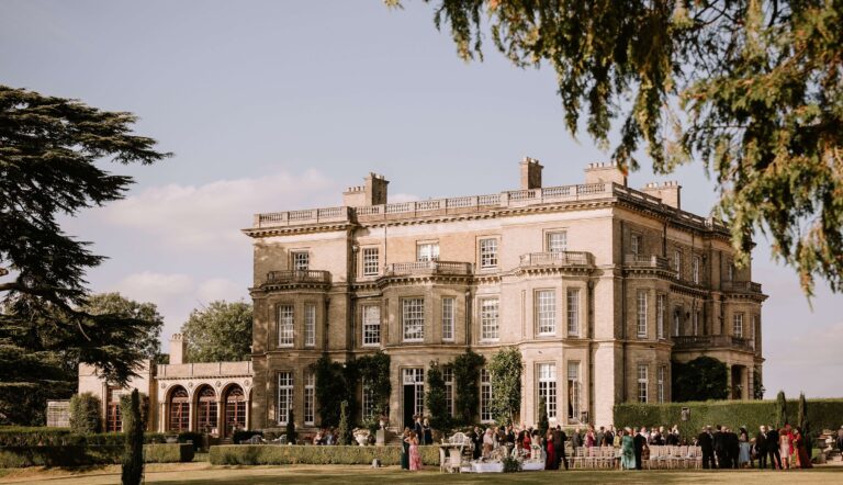 The south front on a summer afternoon, with a drinks reception set out on the lawn below the house, Hedsor House