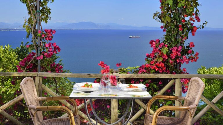A table for two among bougainvillea, looking out to sea, Hotel Raito