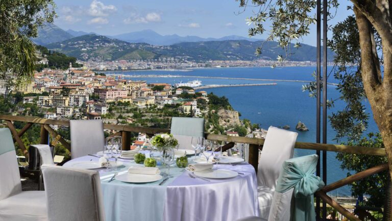 Round tables laid on a garden terrace above Vietri sul Mare and the gulf, Hotel Raito