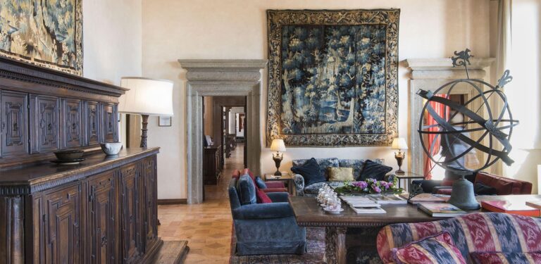 A salon with 17th-century tapestries, antique furniture and an armillary sphere, La Posta Vecchia Hotel