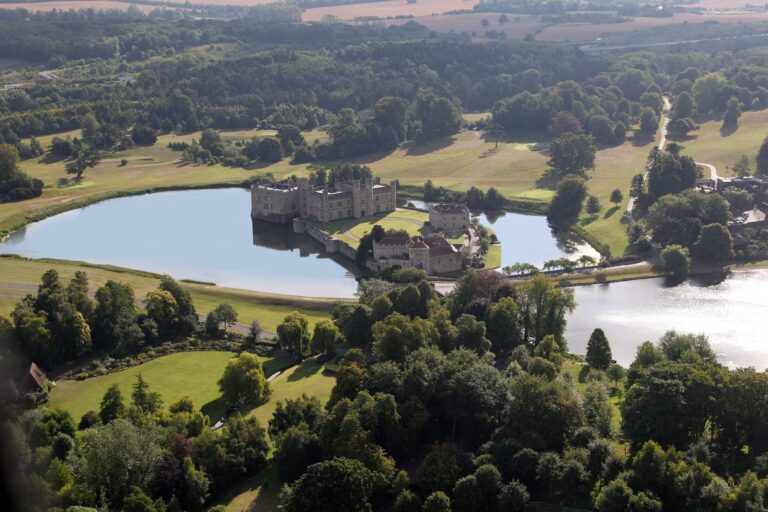 Aerial view of the Castle on its two islands in the moat, with the Great Water and the parkland around it, Leeds Castle