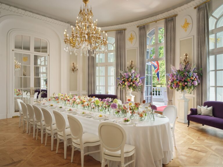 A long table laid for a celebration in the Loggia, with open French windows onto the terrace, Mandarin Oriental Hyde Park