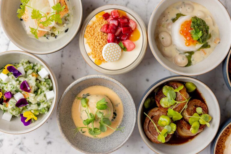 Several small bowls of food seen from above on a marble surface, Plaisterers' Hall
