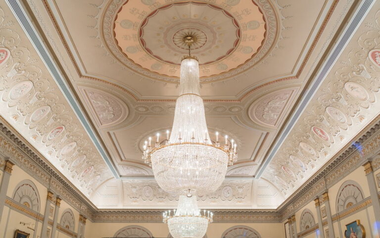 The plasterwork ceiling of the Great Hall with a large crystal chandelier, Plaisterers' Hall