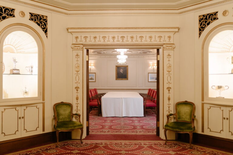 Looking through double doors from an anteroom with arched display niches into the Humber Room, Plaisterers' Hall