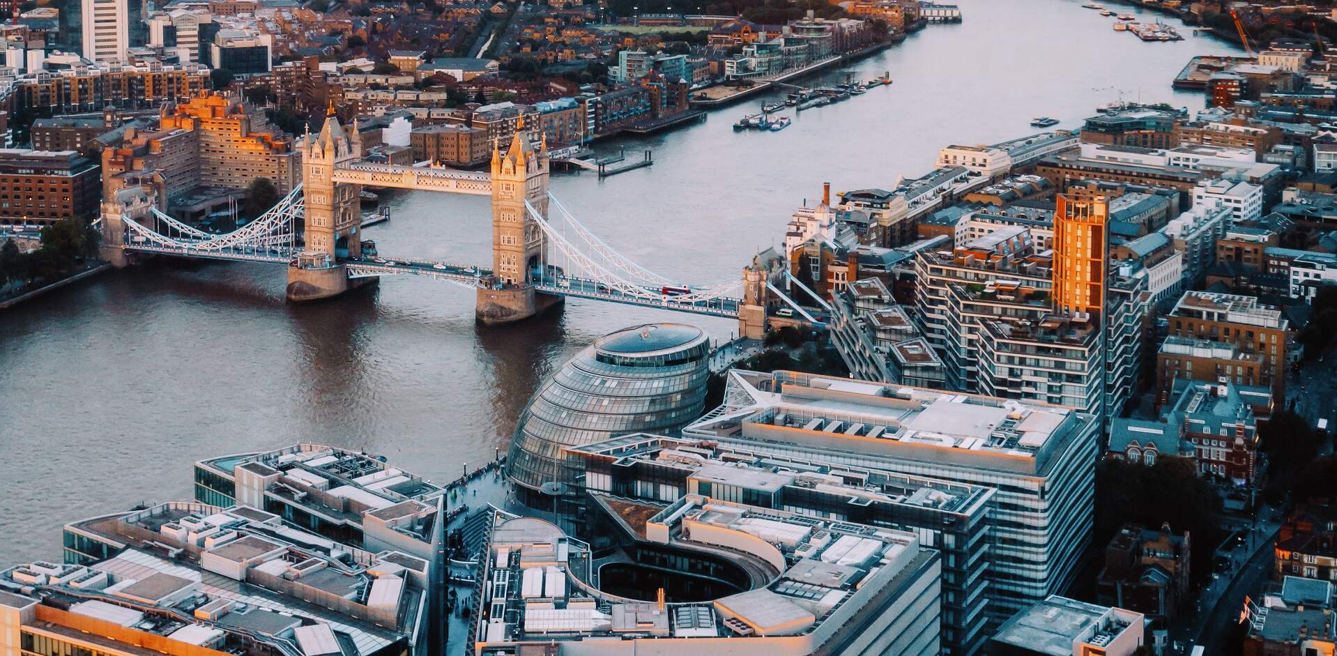 An aerial view down the Thames to Tower Bridge and City Hall at sunset, Shangri-La The Shard, London