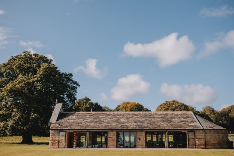 The Deer House, a long stone building in the Deer Park, beneath an old oak, Swinton Park