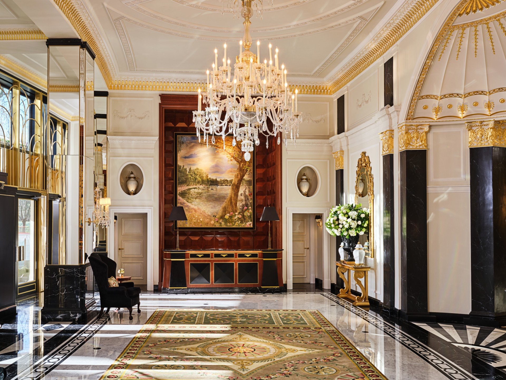 The lobby with its gilded columns, chandelier and marble floor inlaid with a pattern, The Dorchester