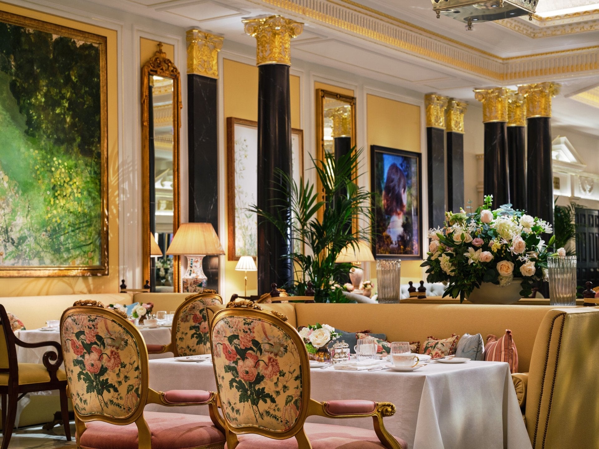 The Promenade set for tea, with painted panels, black columns and flowers, The Dorchester