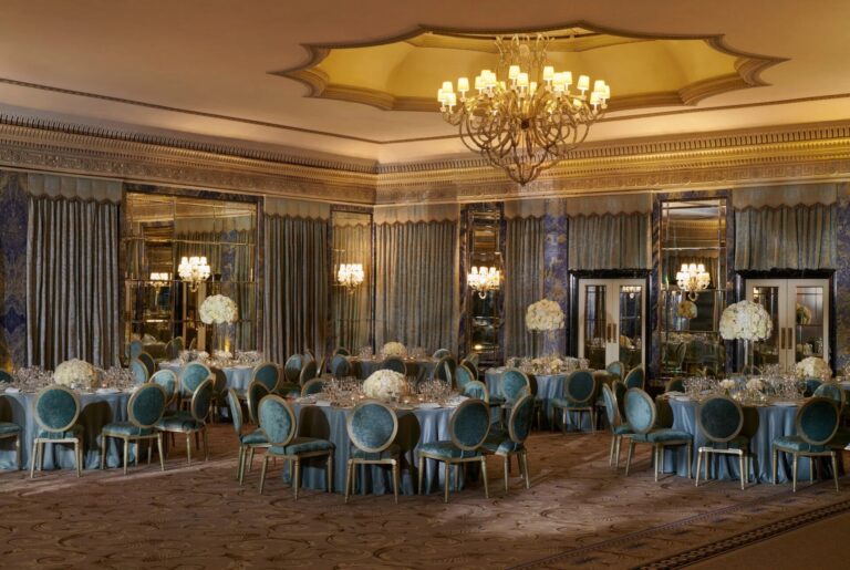 The Ballroom dressed with blue tablecloths, tall arrangements and candelabra, The Dorchester