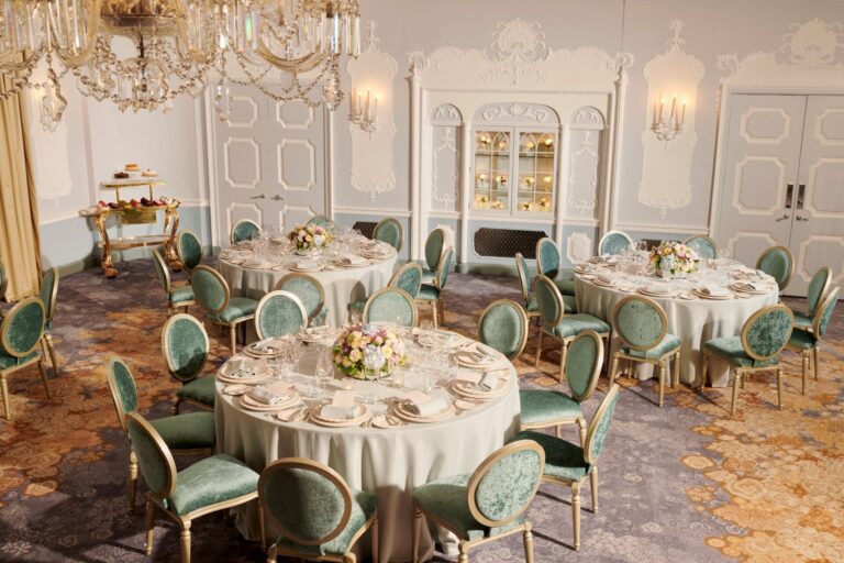 The Orchid Room with round tables, green chairs and white panelled walls, The Dorchester