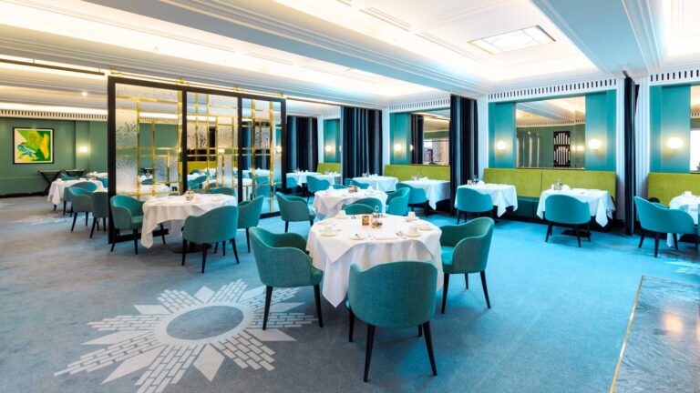The Dining Room, with teal chairs and white-clothed tables, The Lansdowne Club