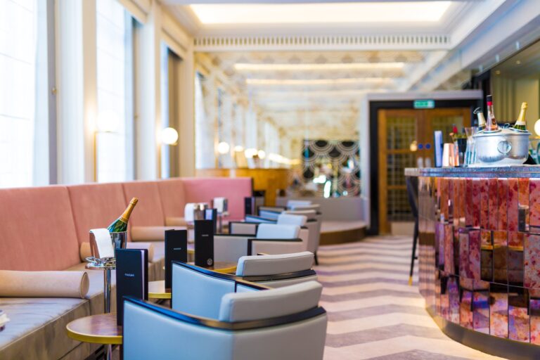 The Piano Bar, with pink banquettes and a mirrored bar, The Lansdowne Club