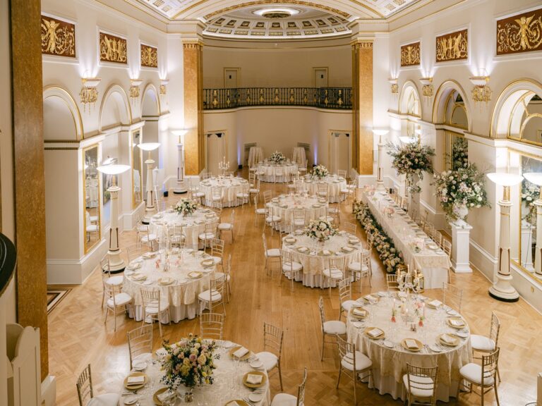 The Ballroom from the gallery, with round tables and a long table laid for dinner, The Lansdowne Club