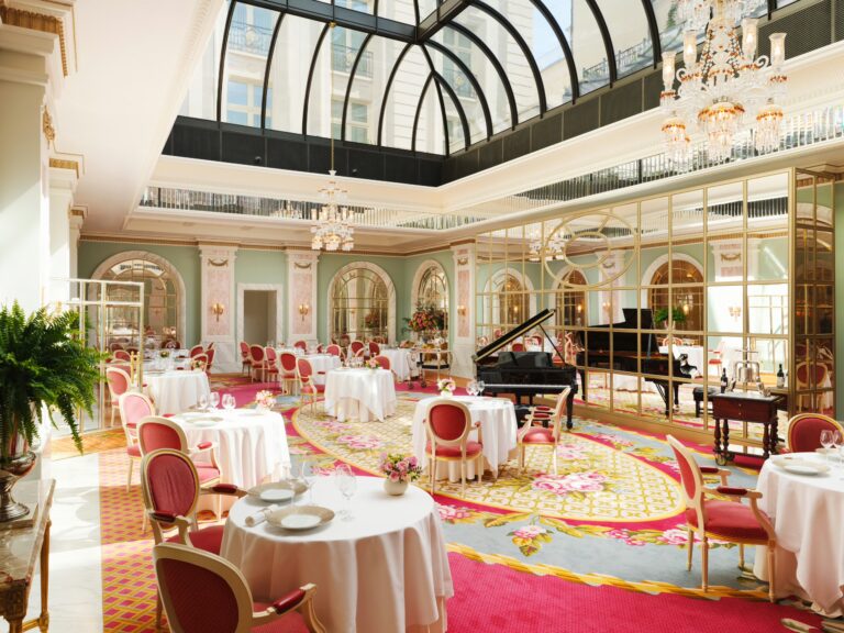 Tables in the Ritz Restaurant beneath the glass ceiling and chandeliers, The Ritz London