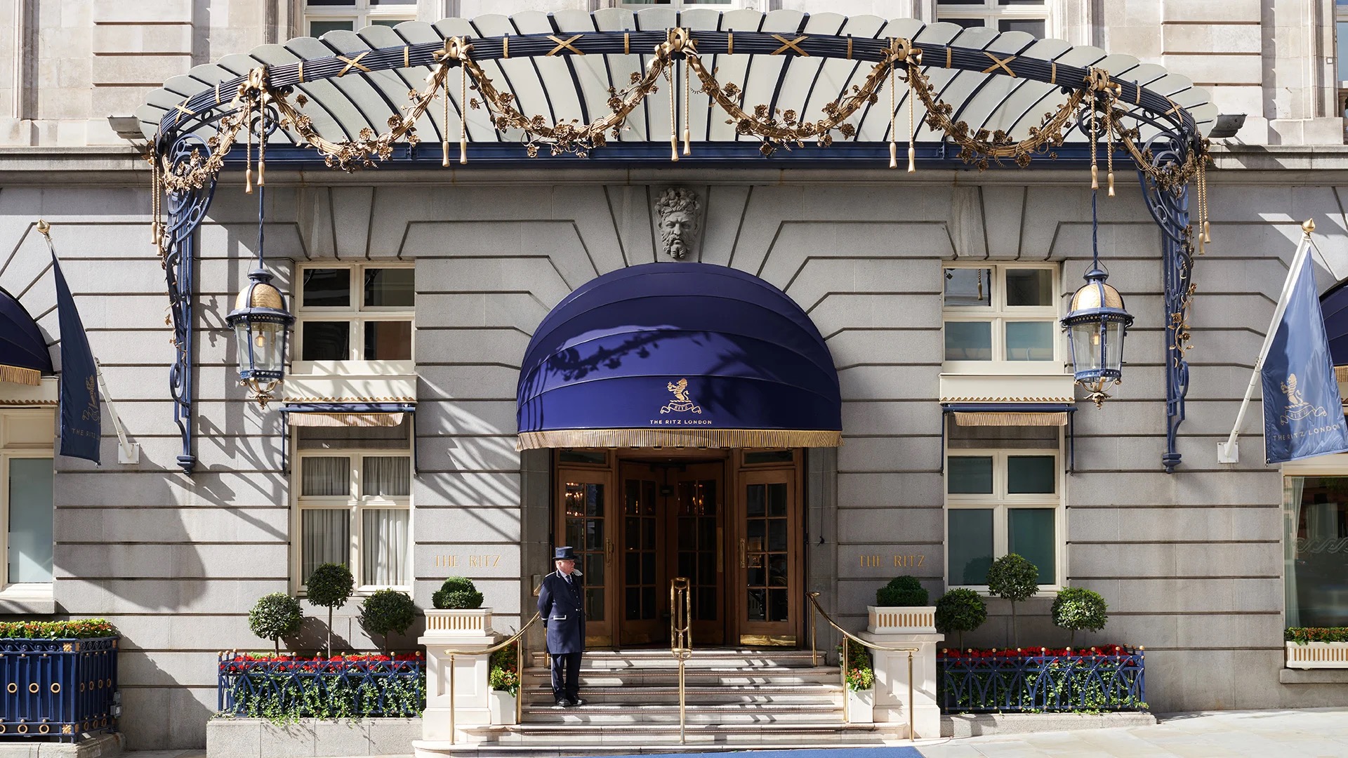 The stone facade and entrance canopy, with a doorman on the steps, The Ritz London