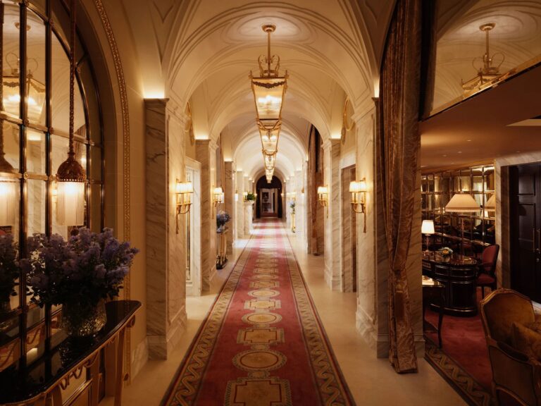 The Long Gallery, a vaulted corridor with a red runner and hanging lanterns, The Ritz London
