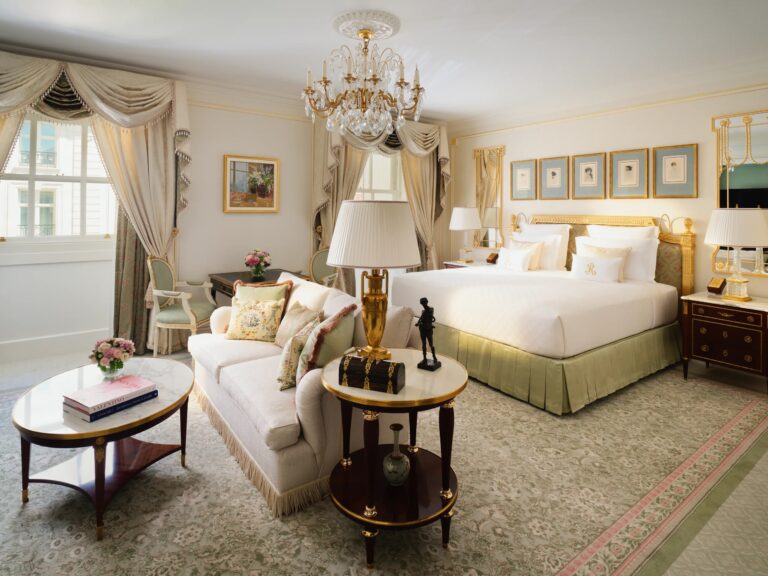 A bedroom in the Arlington Suite with a chandelier and a sofa, The Ritz London