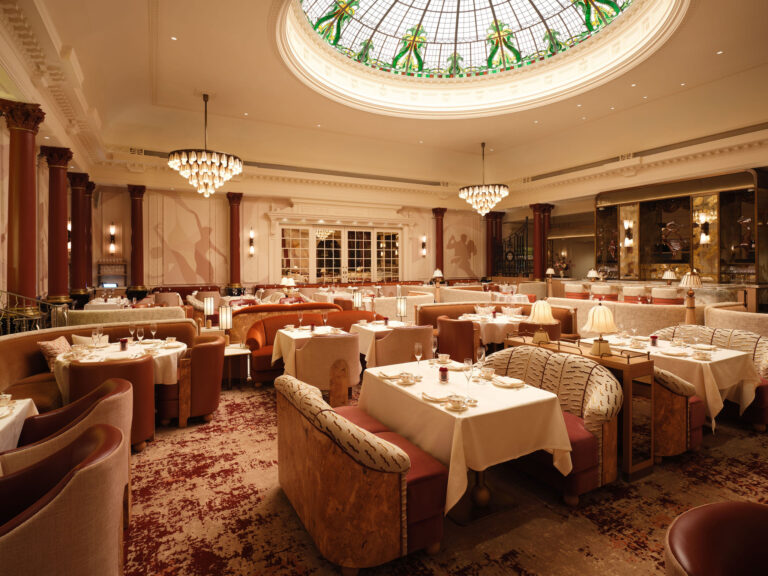 The Thames Foyer, with tables and armchairs beneath its stained-glass cupola, The Savoy