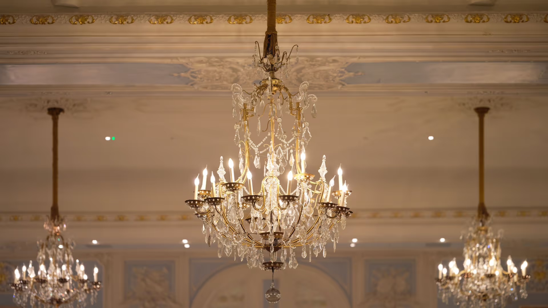 Crystal chandeliers hanging from the moulded ballroom ceiling, The Savoy
