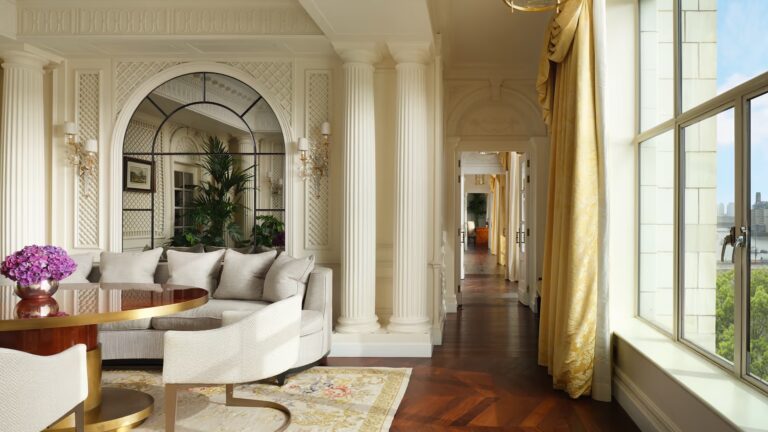 The Royal Suite corridor opening into a sitting area with tall windows, The Savoy
