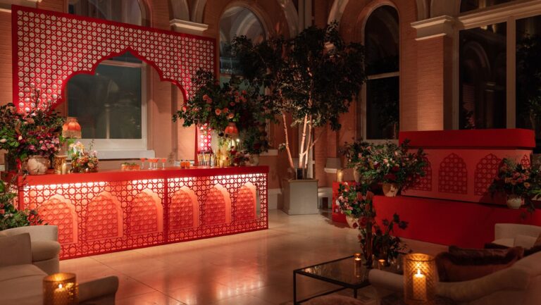 The Courtyard dressed with a red lattice bar, lounge seating and candles, The Wallace Collection