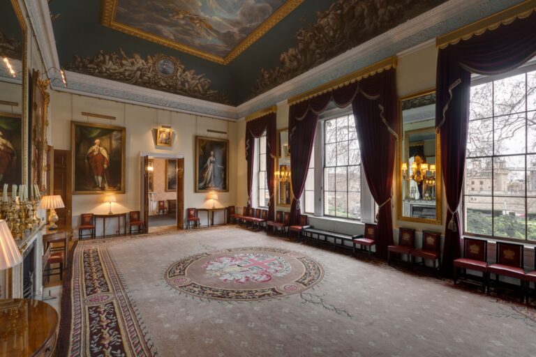 The Court Room with its painted ceiling, full-length portraits, crest carpet and tall windows towards the Tower, Trinity House on Tower Hill