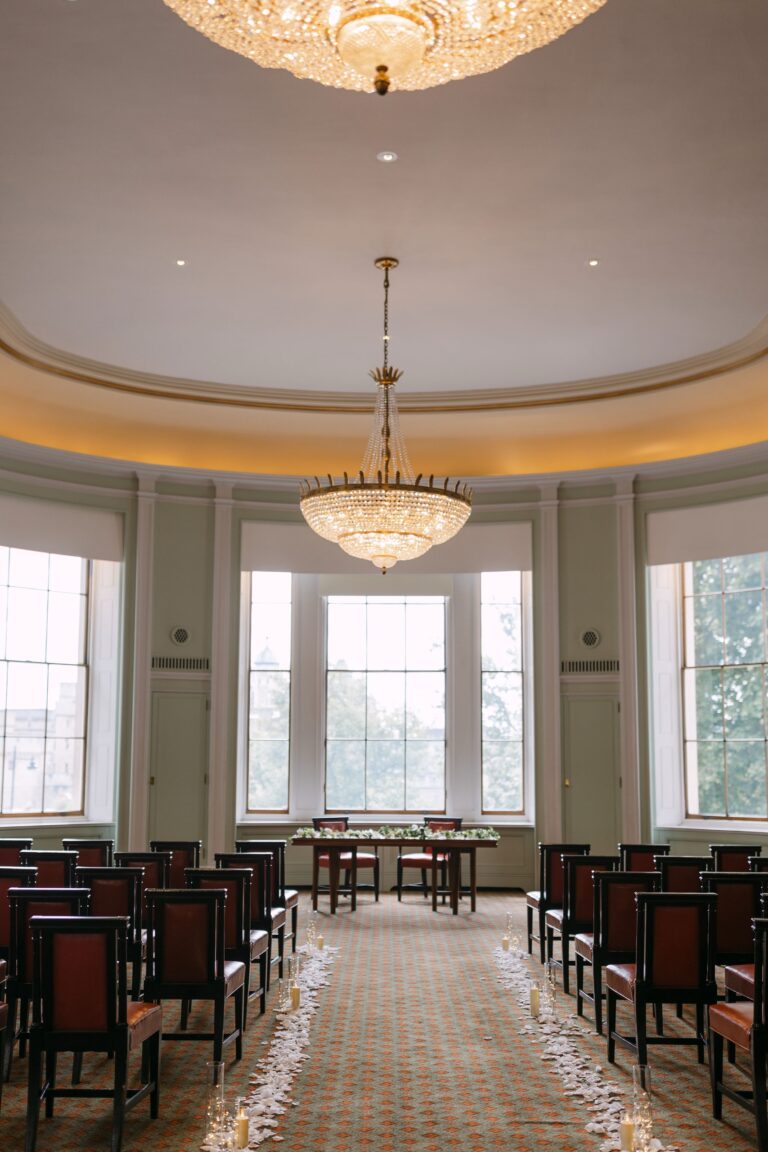 The Library laid out for a ceremony, with a petal-strewn aisle leading to the bay windows, Trinity House on Tower Hill