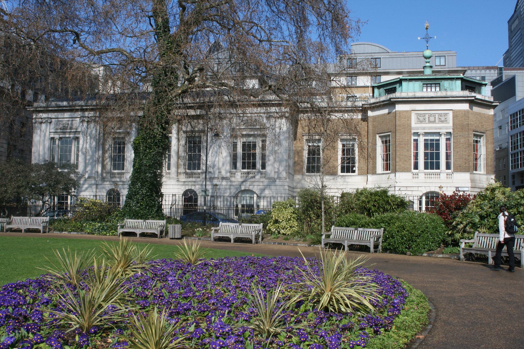 Trinity Square Gardens in spring, with Trinity House and its green-roofed corner pavilion behind, Trinity House on Tower Hill