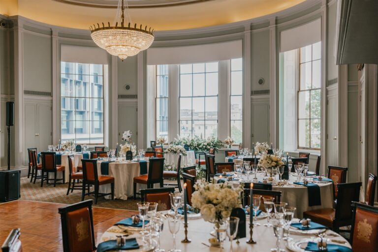 Round tables in the Library set for a wedding breakfast beneath the crystal chandeliers, Trinity House on Tower Hill