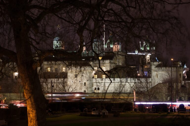 The Tower of London lit at night, seen across Trinity Square from the house side, Trinity House on Tower Hill