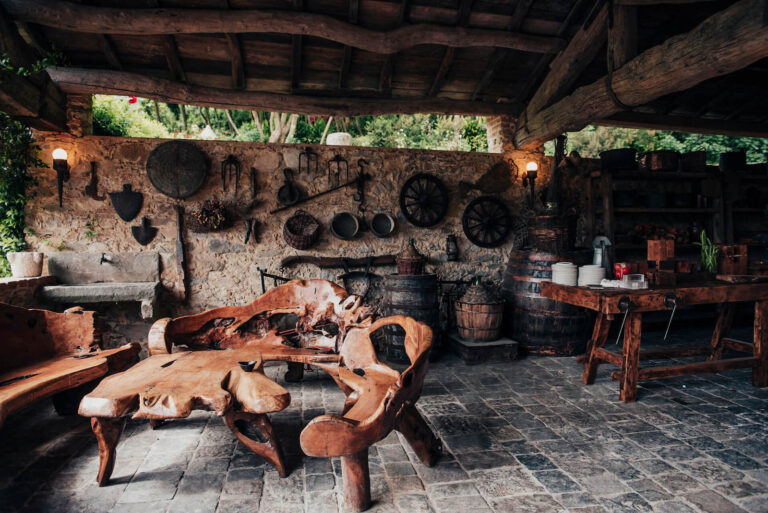 La Greppia, the open-sided rustic barn with stone walls and old farm tools, Valle di Badia