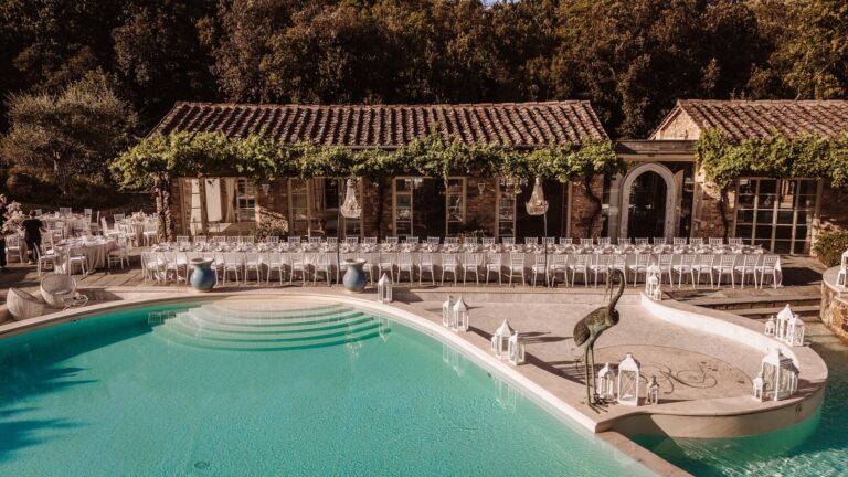 Long tables laid beside the pool in front of the granary, Valle di Badia