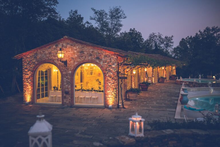 The granary lit at night beside the pool, Valle di Badia