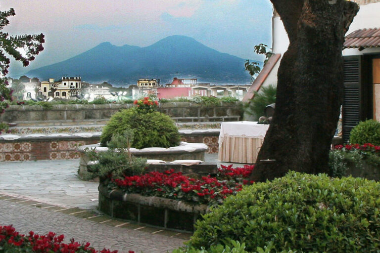 The garden terrace at the entrance, with Vesuvius across the Gulf of Naples, Villa del Vecchio Pozzo in Posillipo