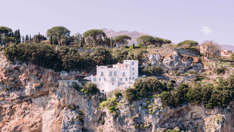 The white villa on the cliff face below Ravello, among pines and olives, Villa La Rondinaia
