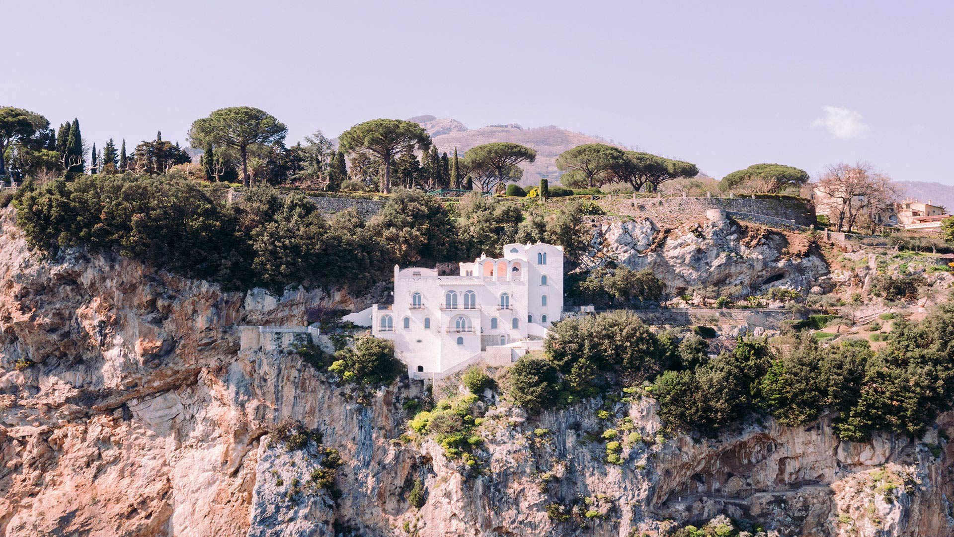 The white villa on the cliff face below Ravello, among pines and olives, Villa La Rondinaia