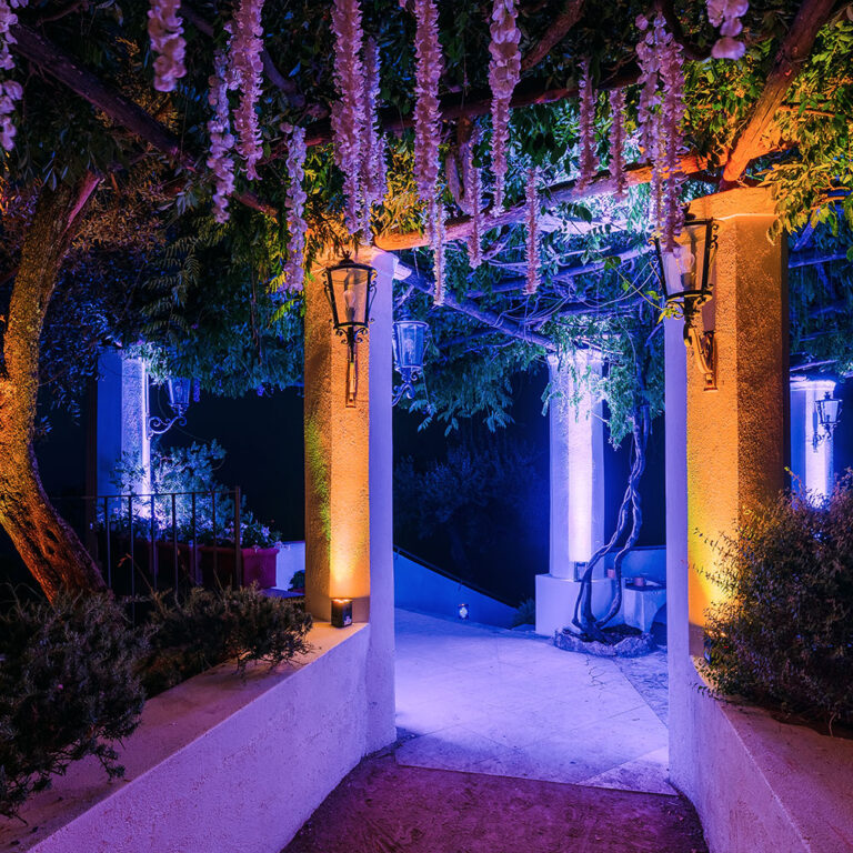 The wisteria pergola lit at night, Villa La Rondinaia