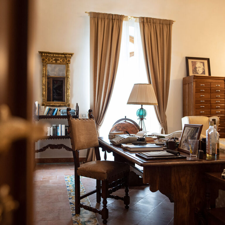 A study with a writing desk, bookshelves and filing cabinet, Villa La Rondinaia