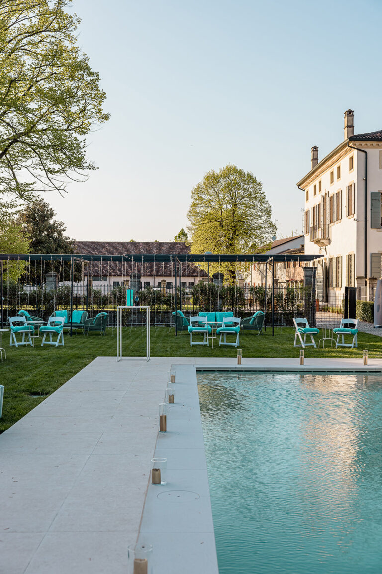 The swimming pool beside the villa, with tables and chairs on the lawn, Villa Ormaneto
